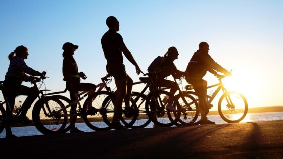 Group cycling in the sunset