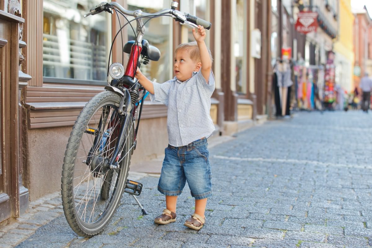 Cute little boy with big bike